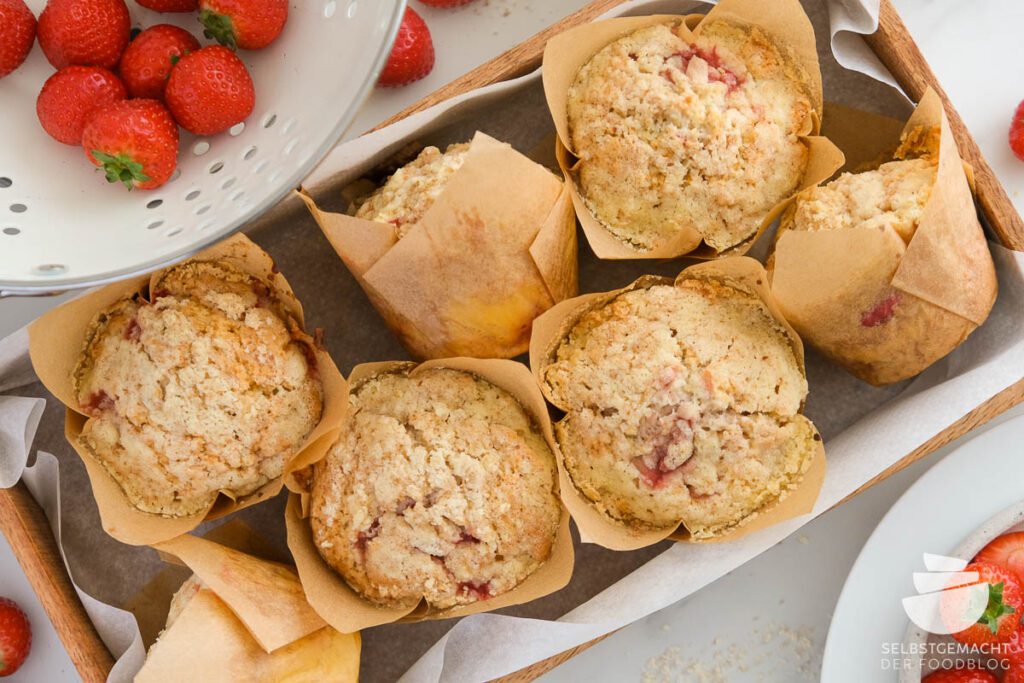 Strawberry cheesecake muffins on a wooden tray